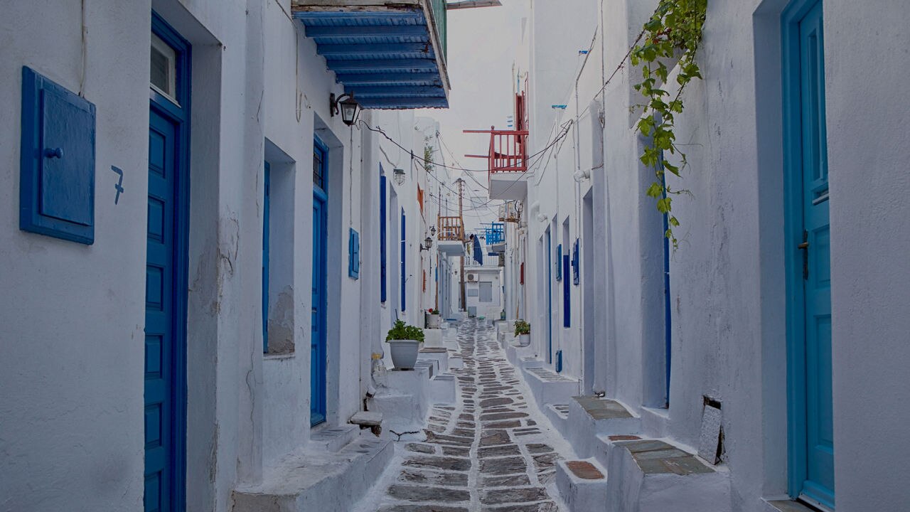 a white and blue alley in Mykonos